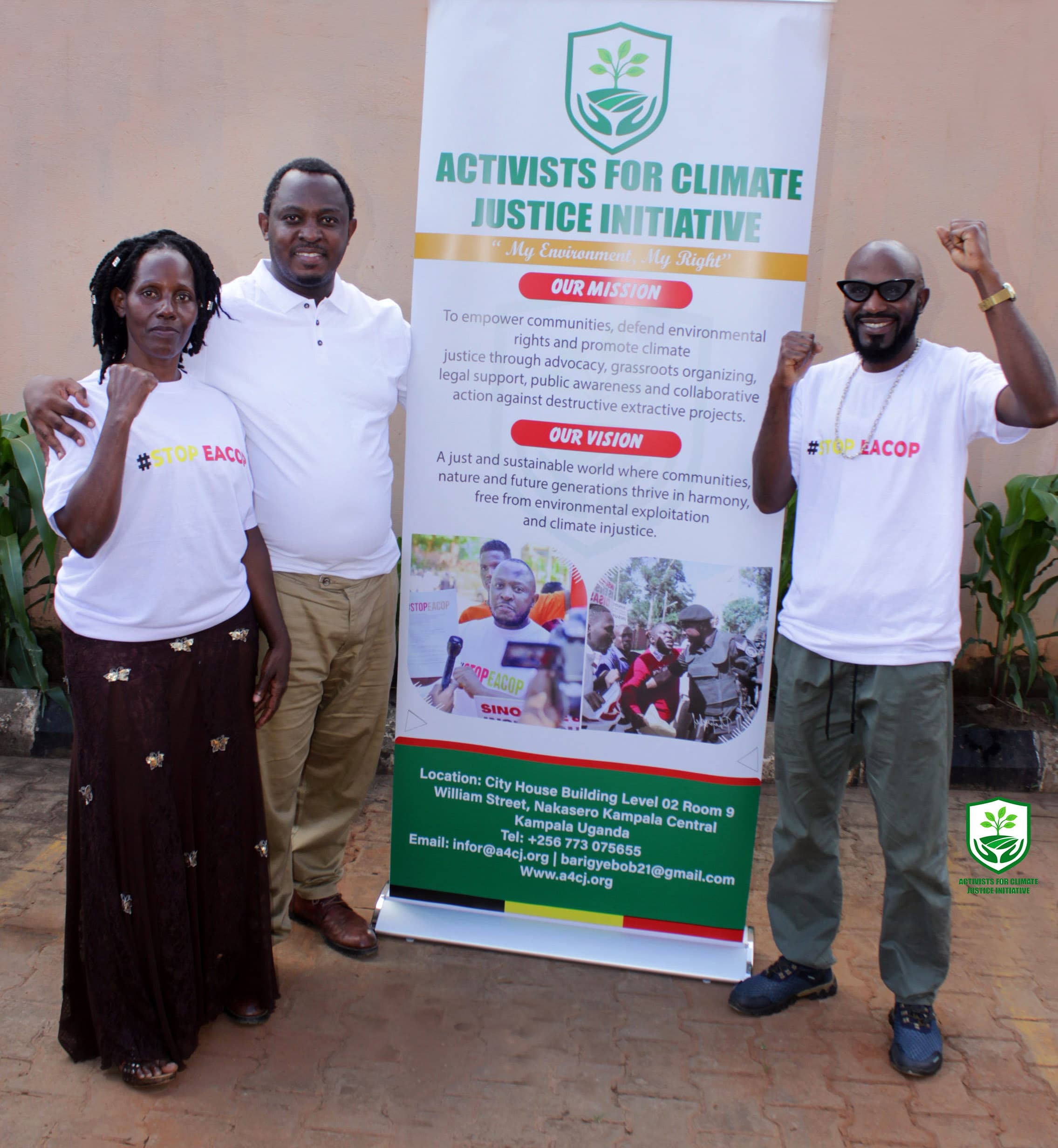 Participants in front of event materials